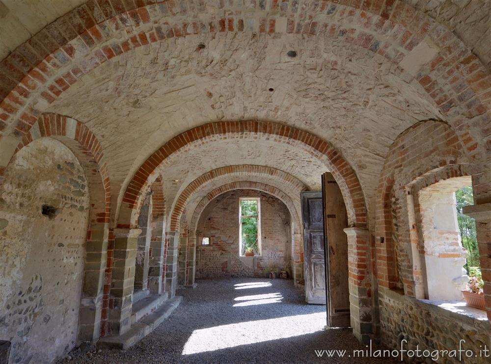 Castelletto Cervo (Biella, Italy) - Portico of the church of the Cluniac Priory of the Saints Peter and Paul